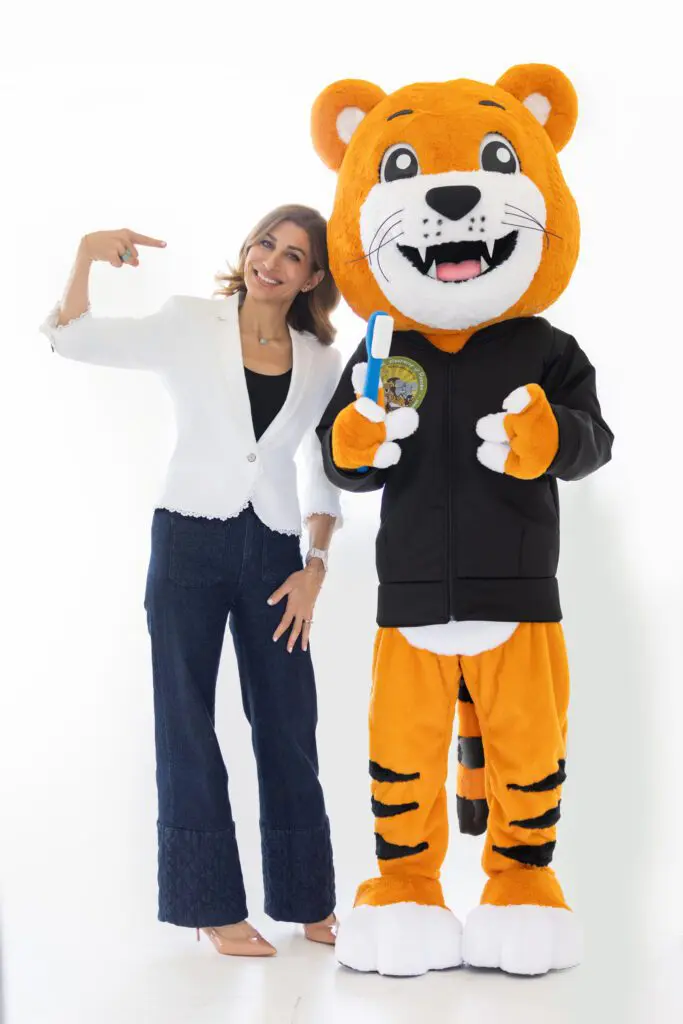 Dr. Neda with Cami the Tiger